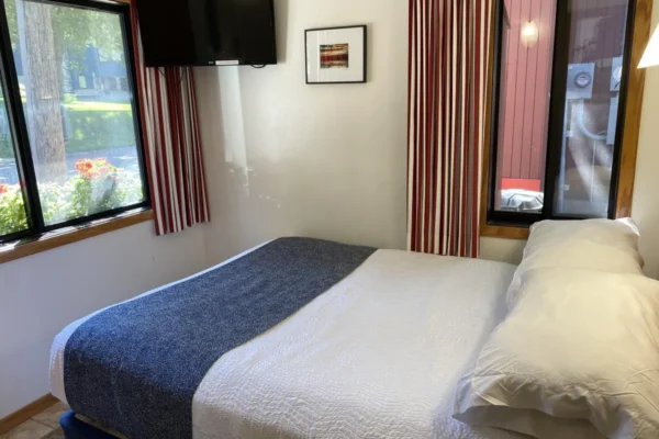 View of the street-side bedroom with a queen bed