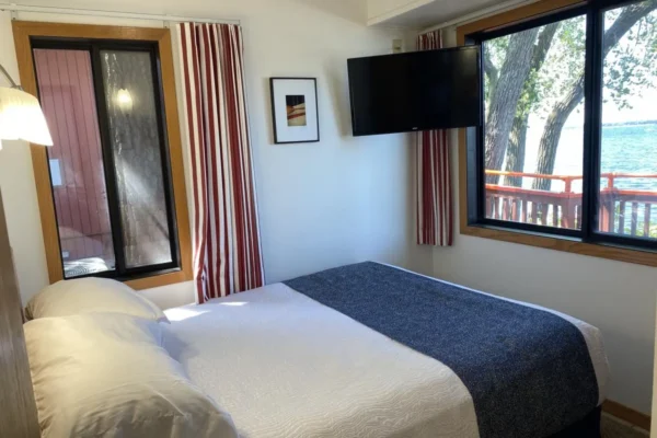 View of the lake-side bedroom with a queen bed