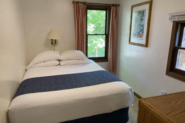 View of the first bedroom with a queen bed